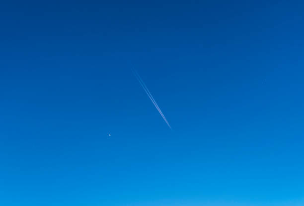 istock Airplane in the blue sky with stars 1467792826