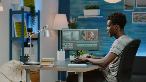 istock Man working as videographer editing video with musical footage 1467792897