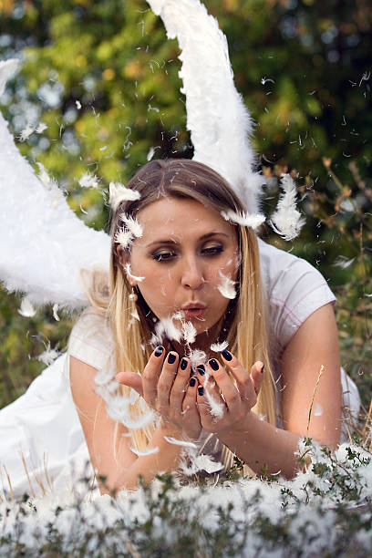 istock Glamourous Blond Angel blows On The Fur 146779412