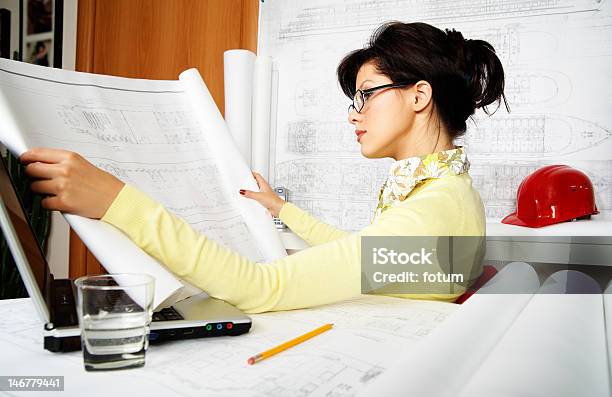 Young Engineer With Blueprints Stock Photo - Download Image Now - Adult, Adults Only, Apartment