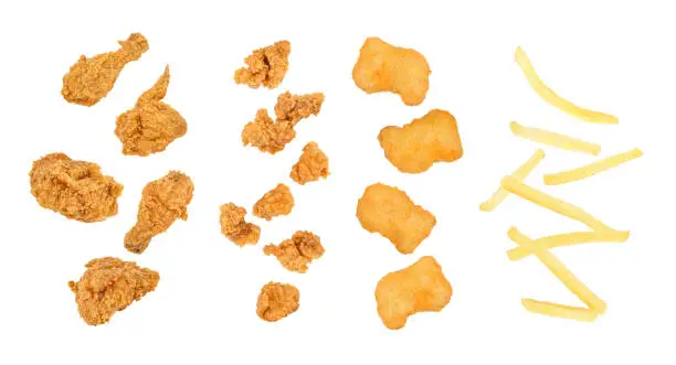 Photo of Fast food set of falling fried chicken, popcorn chicken, nuggets, french fries. isolated on white