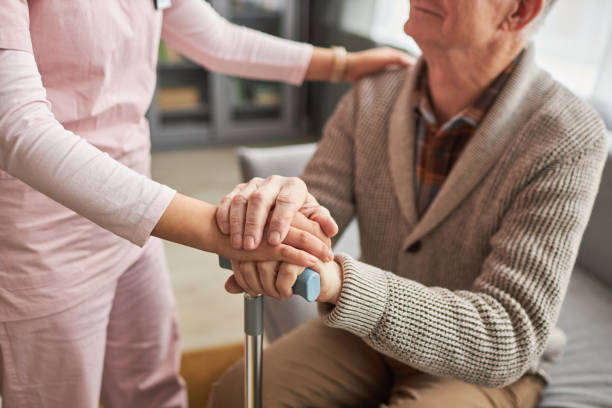 istock Caregiver caring about elderly man 1467798353