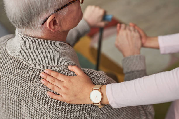 istock Social worker caring about senior patient 1467798354