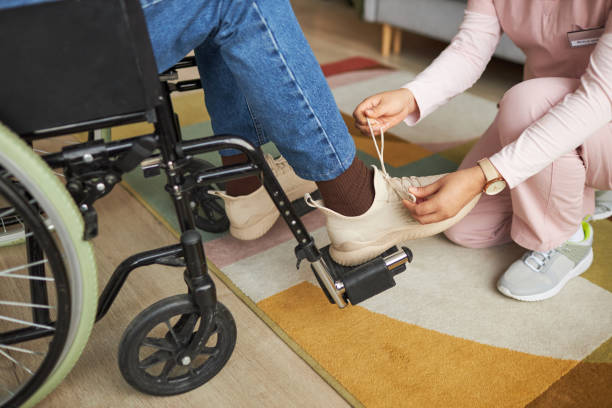 istock Caregiver caring about senior man 1467798397