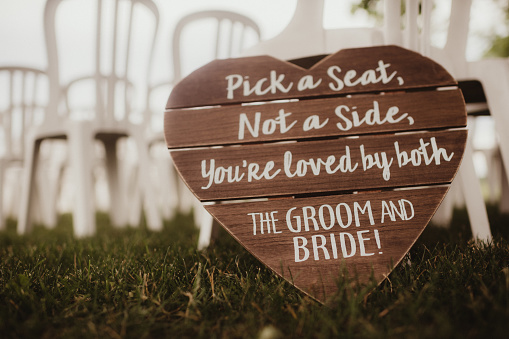 Pick A Seat Not A Side Wedding Wood Sign Stock Photo - Download
