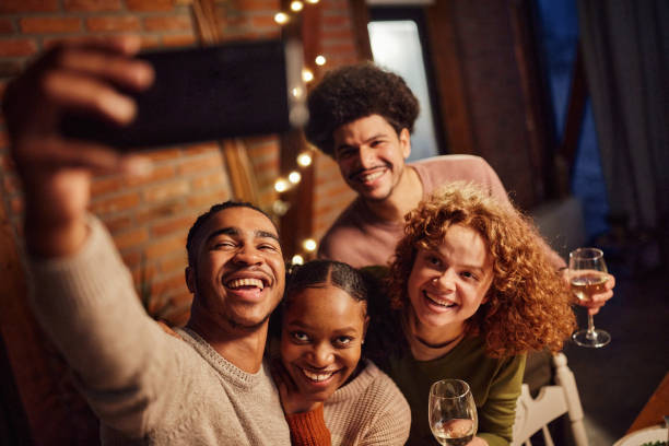 istock Happy couples taking a selfie with cell phone at home. 1467799690