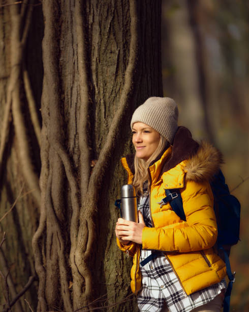 istock Smiling female hiker day dreaming on a break in autumn day. 1467801232