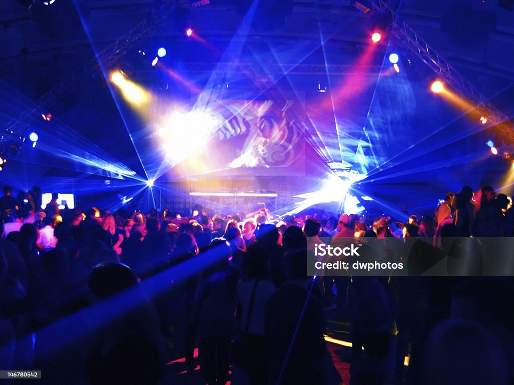 Motion Blur of dancing people in a disco Nightclub Stock Photo