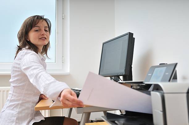 istock Business person working with printer 146780999
