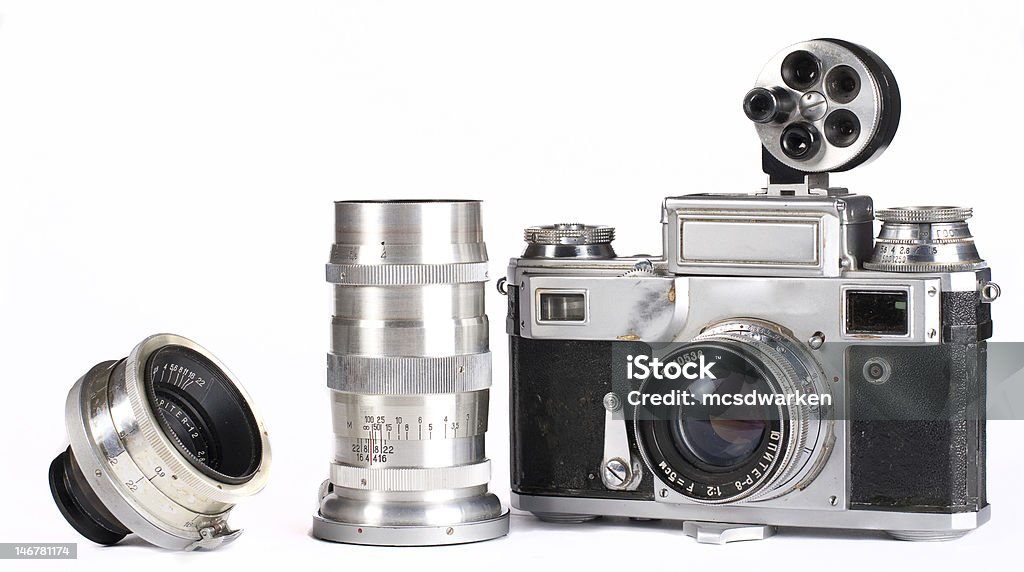 Retro photocamera with set of lens Retro vintage photocamera with with set of lenses isolated on white background 1970-1979 Stock Photo