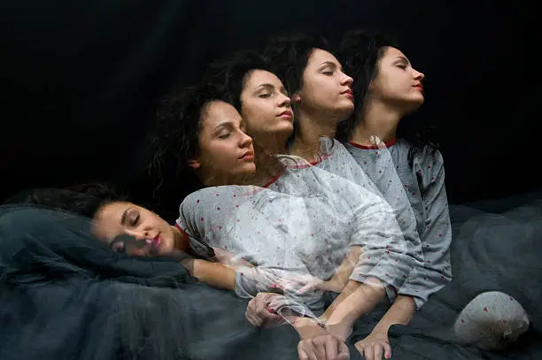 Multiple exposure of sleeping girl getting up