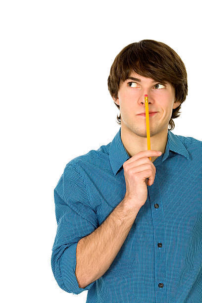 istock Young man holding pencil 146781779