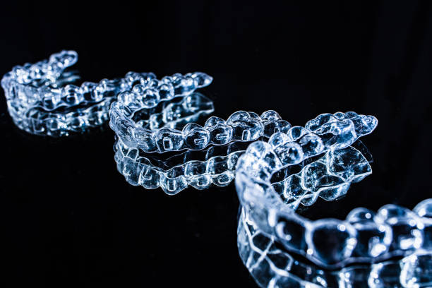 istock Invisible aligners teeth retainers lie on the mirror 1467818398