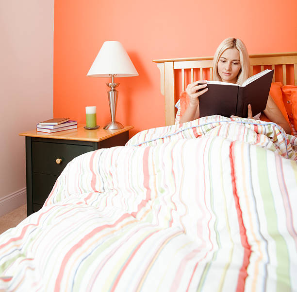 istock Woman Reading in Bed 146781892