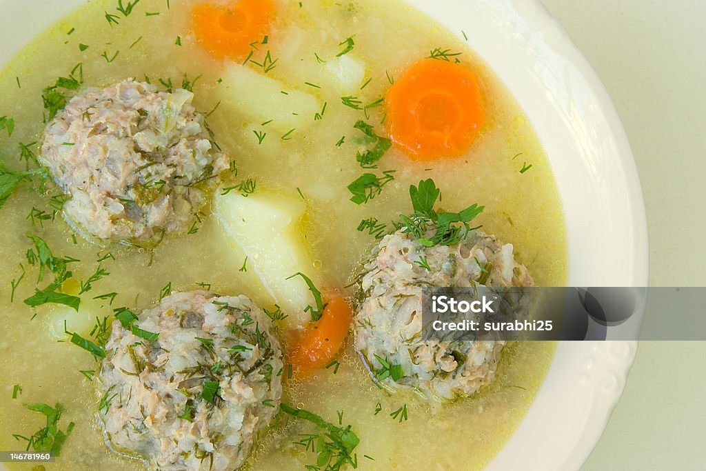 soup soup with meatballs, potatoes,carrot,parsley and dill in white plate Bowl Stock Photo