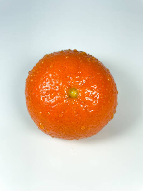 istock Orange tangerine with water drops close-up on a white background 1467821303