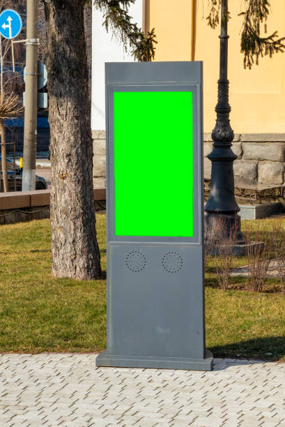 istock Billboard or information terminal on the street with a large screen chromakey green 1467823048