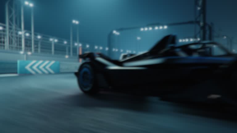 3D Animation of Fast Accelerating High Performance Electric Racing Car is Driving on Track at Night Time.