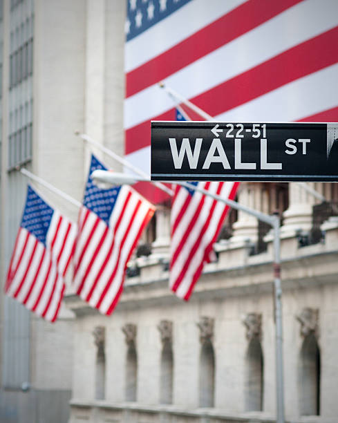istock USA flags on emblematic Wall Street building 146782407