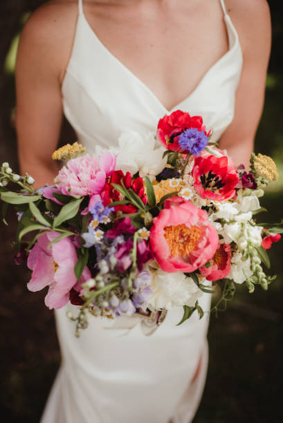 istock Close up of bride holding her wedging bouquet 1467826032