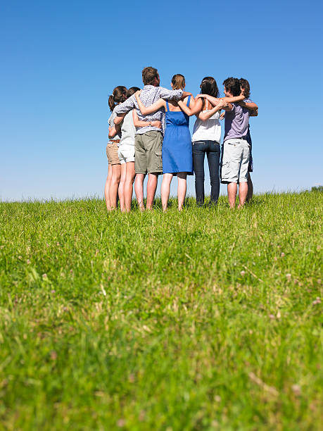 istock Group of People Huddled in Field 146782620