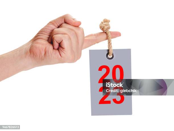 2023 Tag On Thick Rope Hanging On Finger Stock Photo - Download