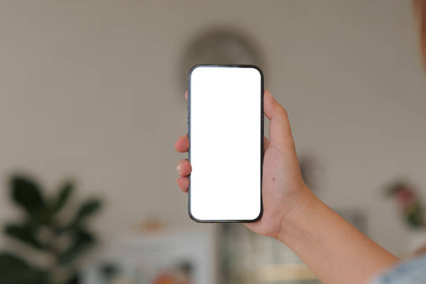 istock Close up of Man holding mobile phone with white background. 1467826680