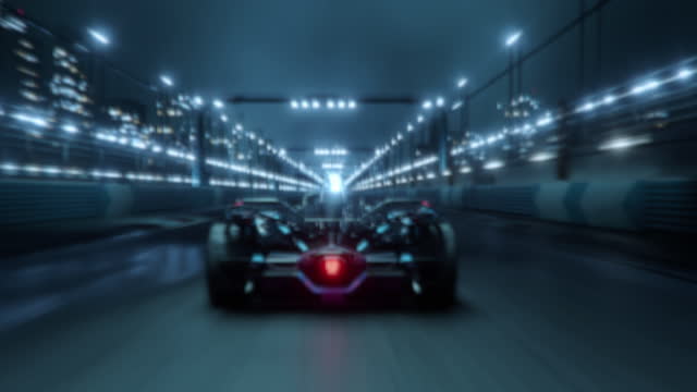 Accelerating High Performance Electric Racing Car is Driving on Track at Night Time. Camera follows the Vehicle.