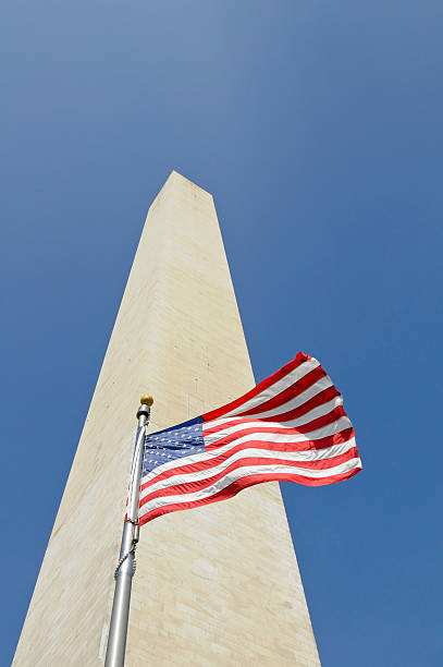 istock Washington Monument with American flag in front 146783176