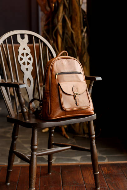 istock Brown leather backpack on the stylish chair 1467832326