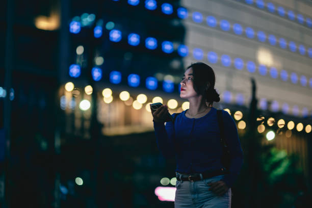 istock Young businesswoman using smartphone in financial district 1467832442