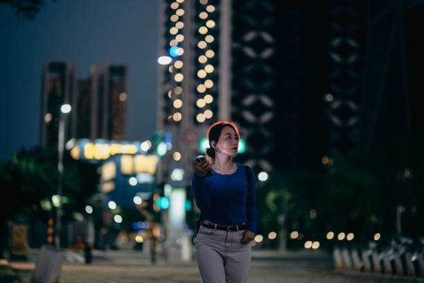 istock Young businesswoman using smartphone in financial district 1467832443
