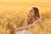 Woman relaxing alone in a field