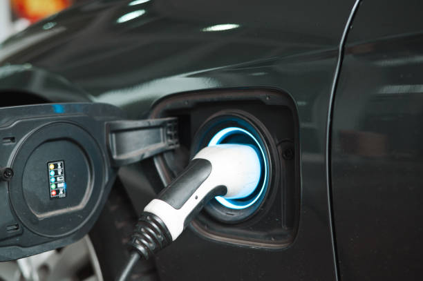 istock Charging electric car with the power cable supply plugged 1467834380