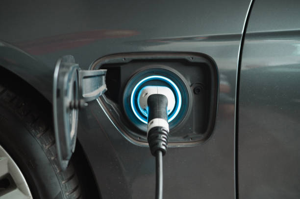 istock Charging electric car with the power cable supply plugged 1467834393