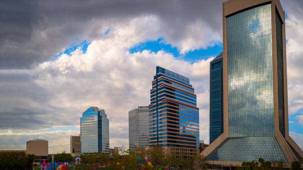 istock Vibrant Jacksonville City Skyline and Buildings with dramatic cloudscape over the Riverfront Plaza Park in North Florida, USA, modern cityscape with space for family recreation 1467835250