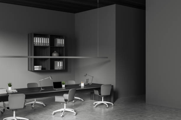 istock Grey meeting room interior with chairs and table, laptop and decoration 1467836364