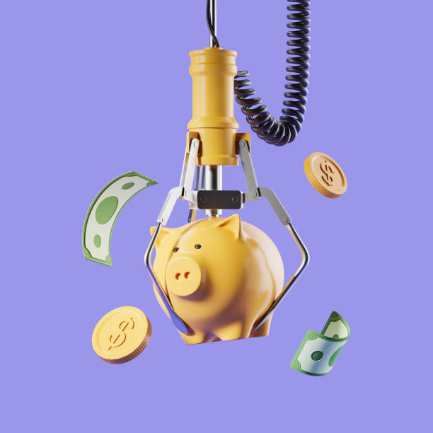 istock Robot arm with a piggy bank and money falling 1467836770
