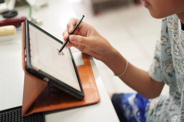 istock A picture shows a student using a tablet computer device for homework for the teacher.; 1467837550