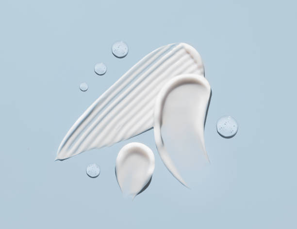 istock cosmetic smears cream texture on pastel blue background 1467842089