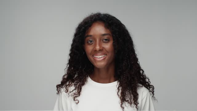 Portraits of people looking at camera on grey background close up. Modern concept of mixed races or multiethnic diversity of women together. Ethnicity of afro female with little girl and older human