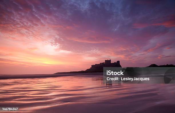Bamburgh Castle And Sands Stock Photo - Download Image Now - Bamburgh Castle, Sunrise - Dawn, Architecture