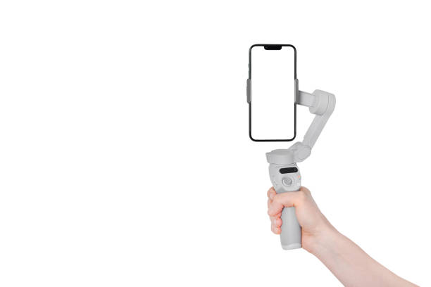 istock New Mobile gimbal hand holding. New generation of electronic stabilizer. Modern Mobile mockup. Banner with copy space 1467845361