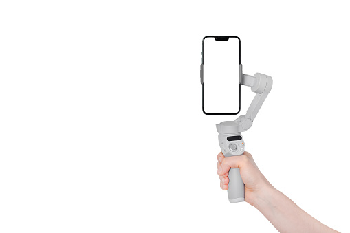 New Mobile gimbal hand holding. New generation of electronic stabilizer. Modern Mobile mockup. Banner with copy space.