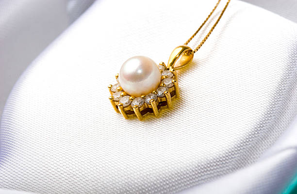 istock Jewelry gold pearl pendant with diamonds inside a gift box 146784613