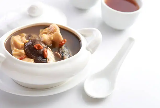 buddha jump over the wall, chinese herbal soup with premium dry seafood in white background