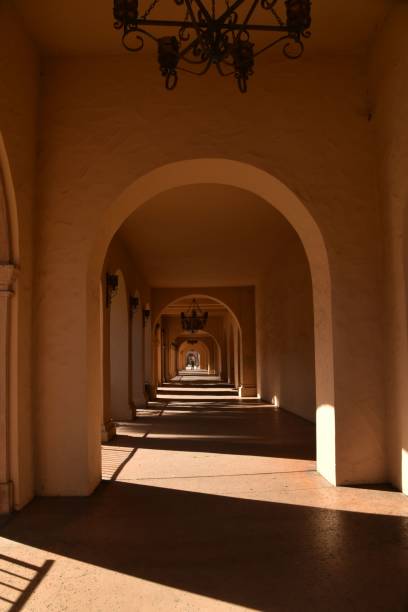 istock Brightly lit hallway featuring two white arches leading to an unseen destination 1467846798