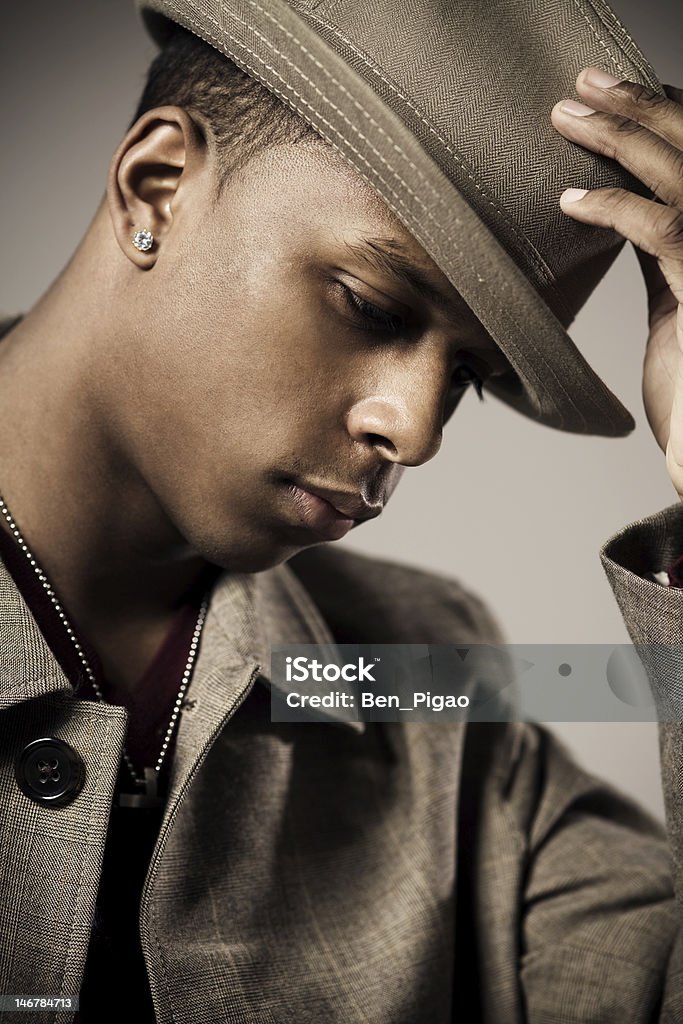 Black Business Man Young man tipping his hat Diamond - Gemstone Stock Photo