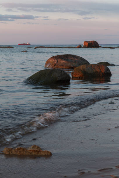 istock Beautiful shoreline with stones at the sunset 1467847850
