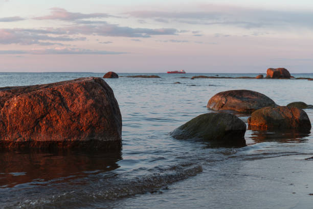 istock Beautiful shoreline with stones at the sunset 1467847856
